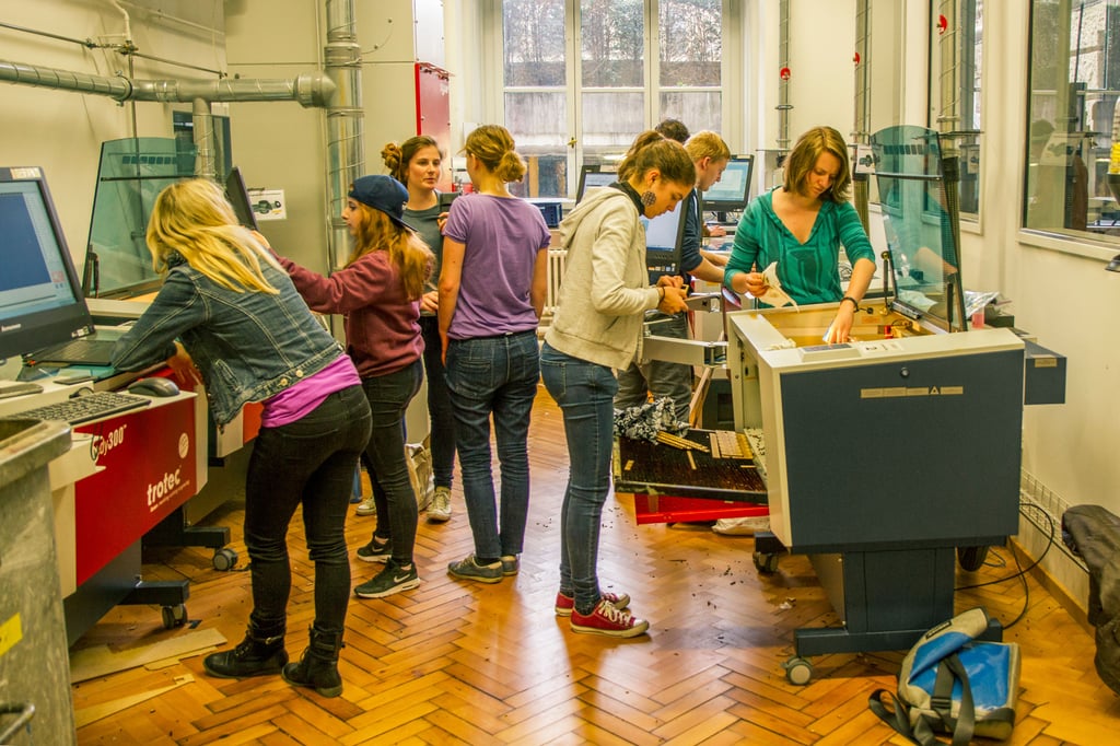 students using laser cutting machines